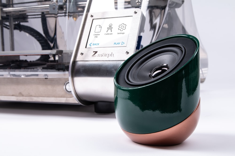 green and brown portable speaker