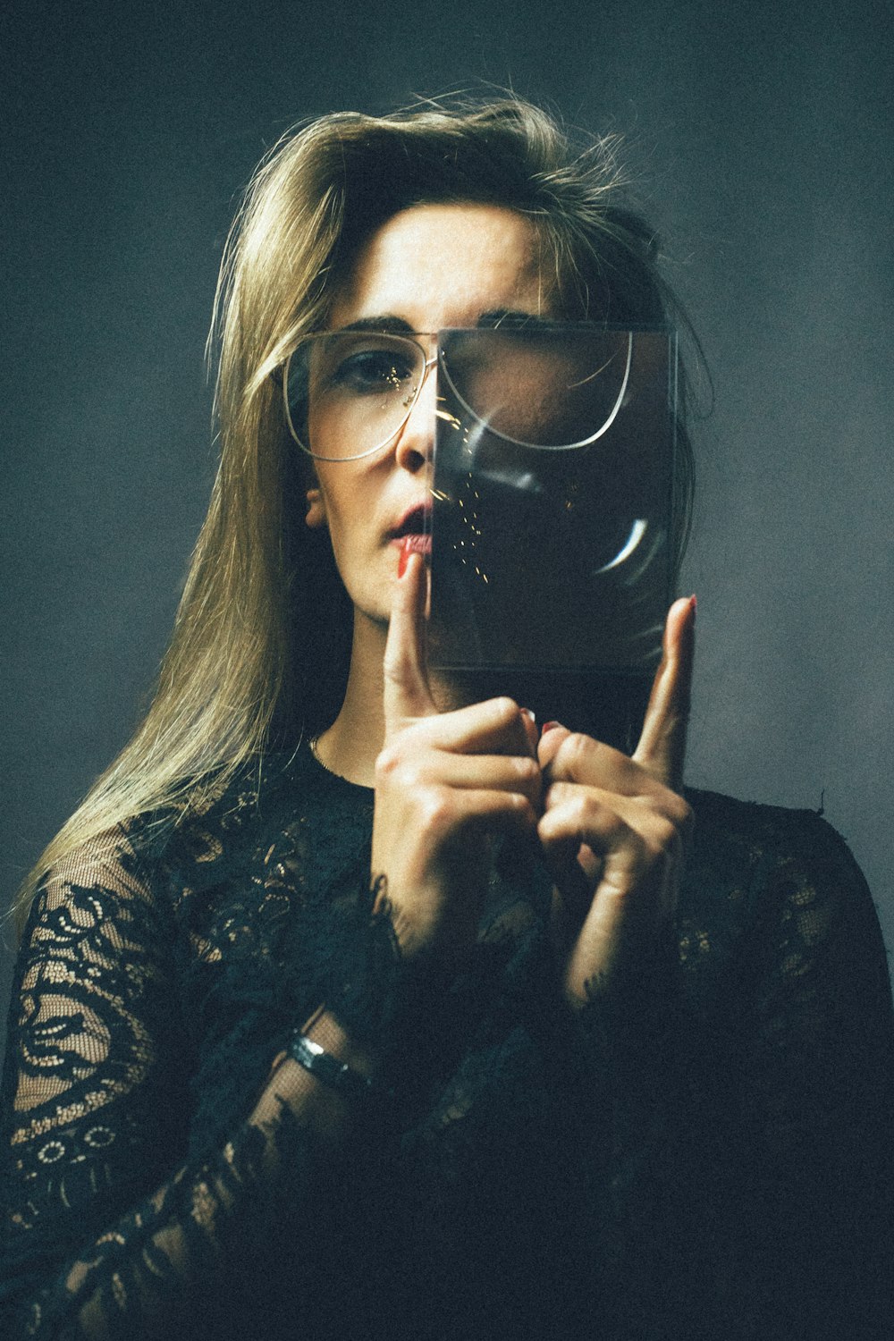 woman holding glass panel
