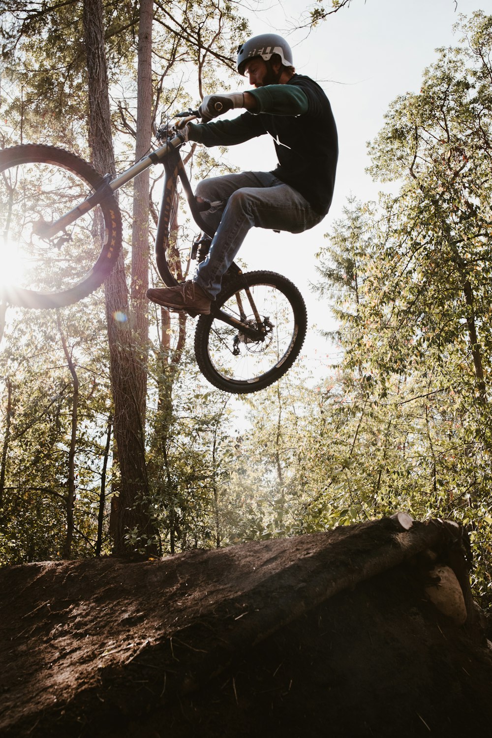 low angle photography of man riding BMX bike