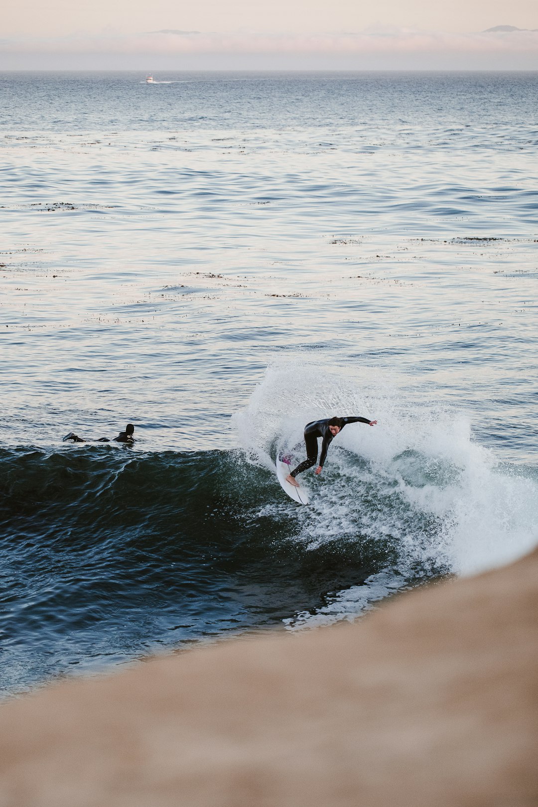 person playing surfboard on wave