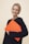 smiling woman standing while holding orange folder