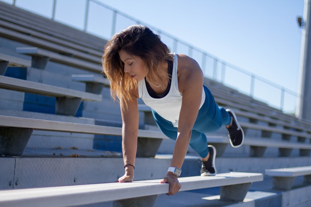 woman exercising in stage during daytime