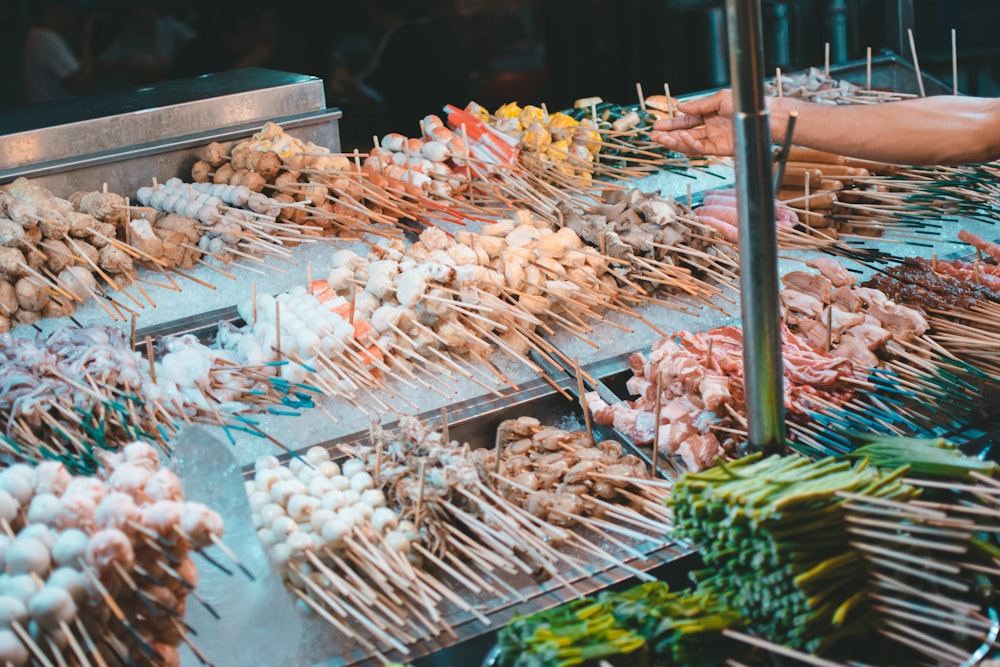 skewered meat on trays with ice packs