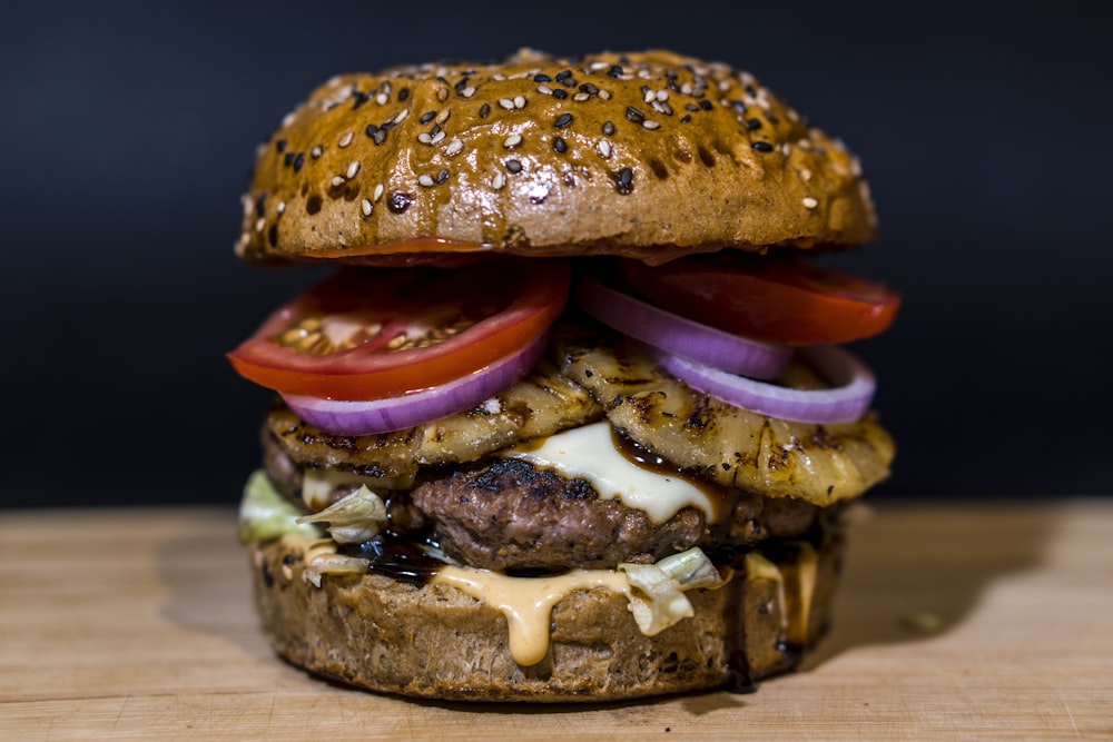 baked burger on brown surface