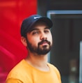 selective focus photography of man wearing Nike dad hat