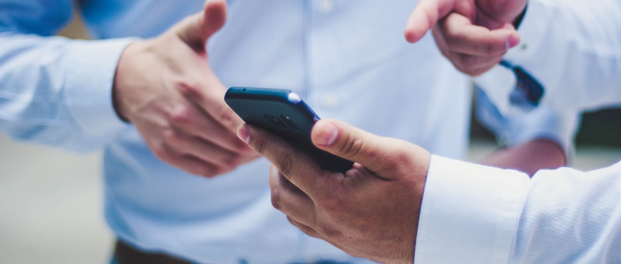 person holding black smartphone