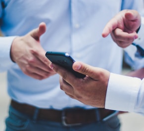 person holding black smartphone