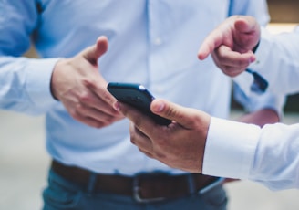 person holding black smartphone