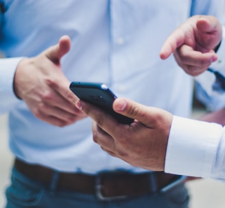 person holding black smartphone