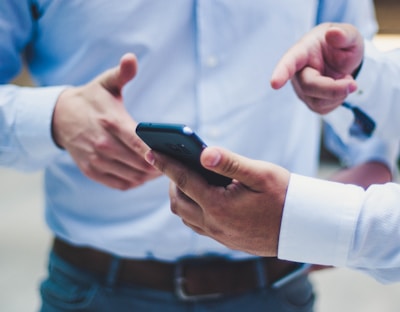 person holding black smartphone