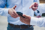person holding black smartphone