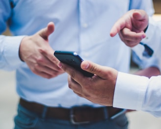 person holding black smartphone