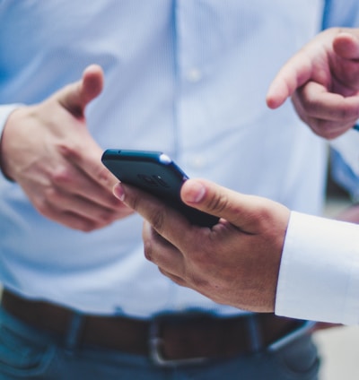 person holding black smartphone