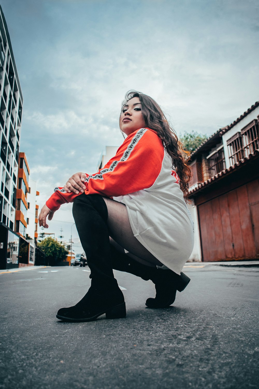 woman wearing orange and white sweatshirt