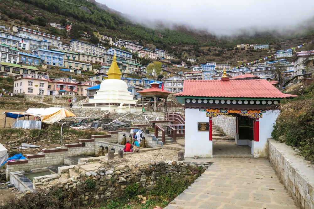 houses under cloudy sky during daytime