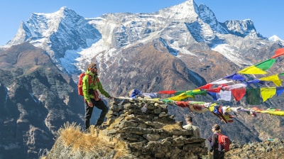 selective focus photography of hiker during daytime