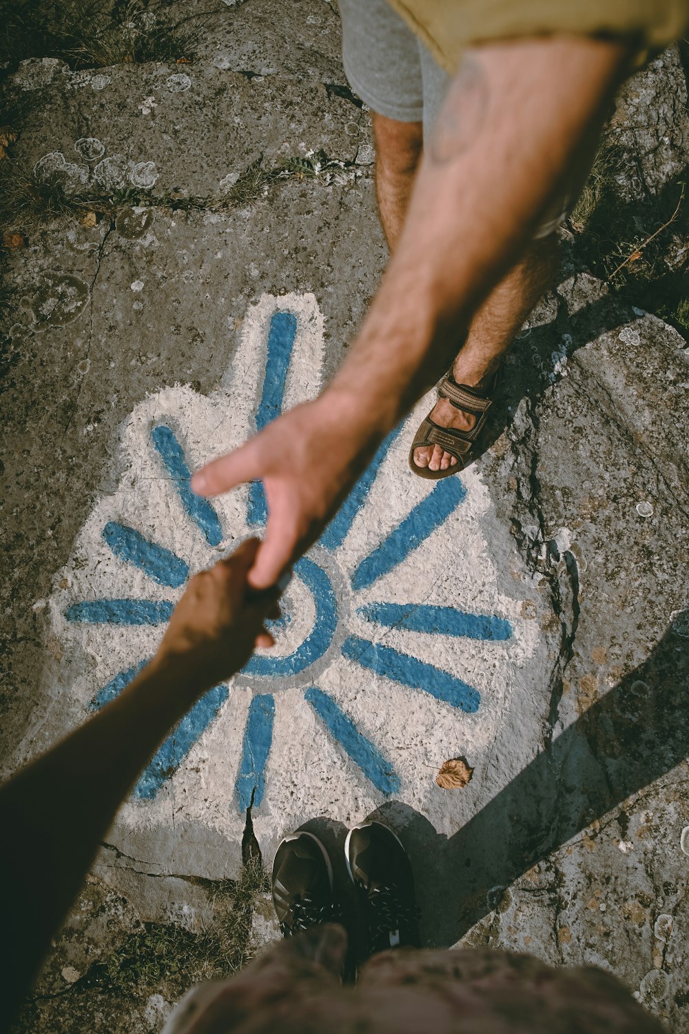 person holding hand of person during daytime