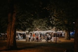 An outdoor networking event with people exchanging ideas.