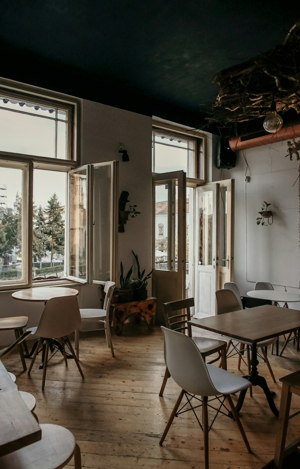 brown wooden dining table beside white chair