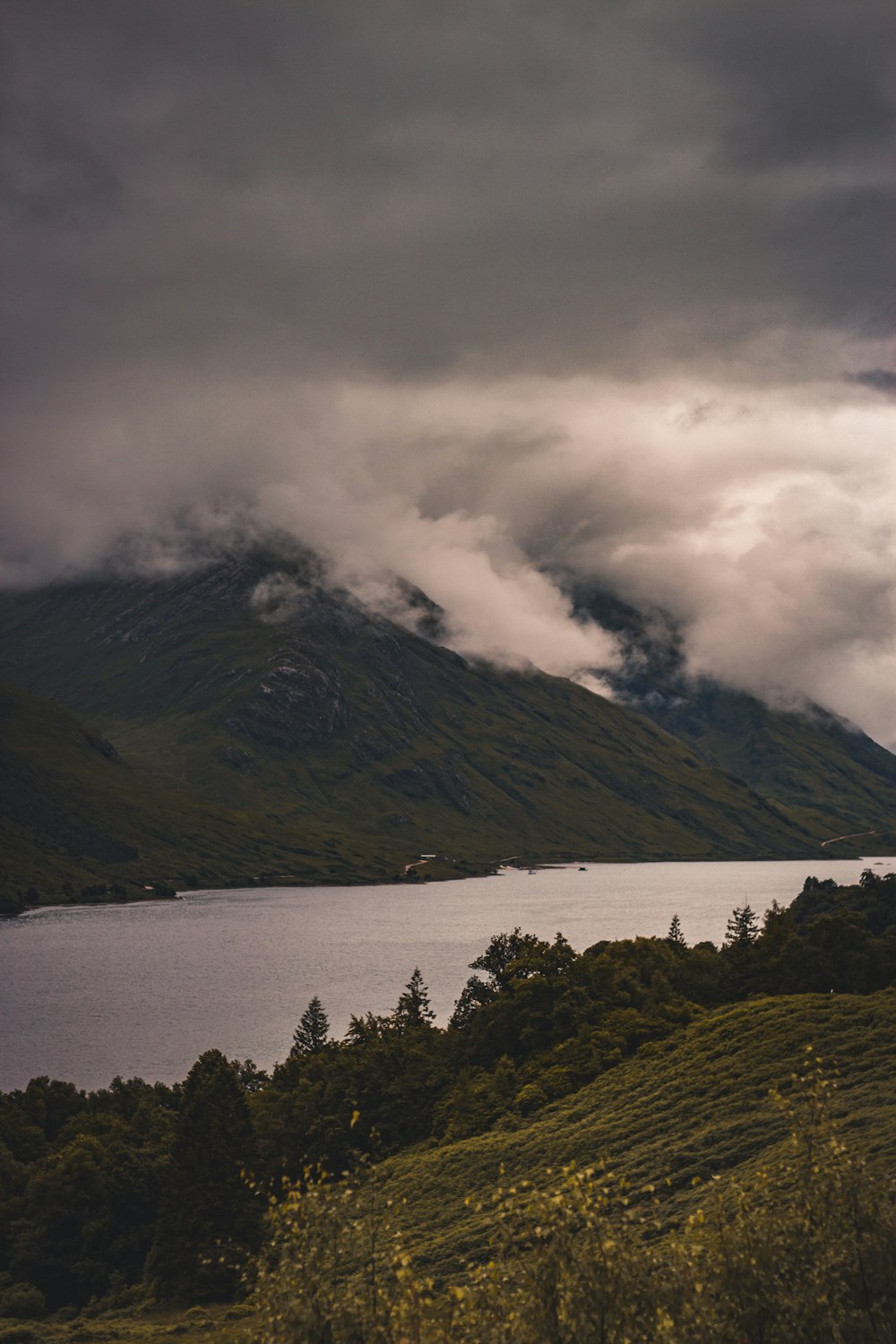 white clouds covering mountain during daytime