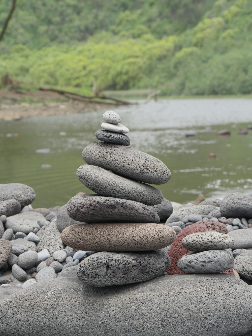 piled of gray stones beside river