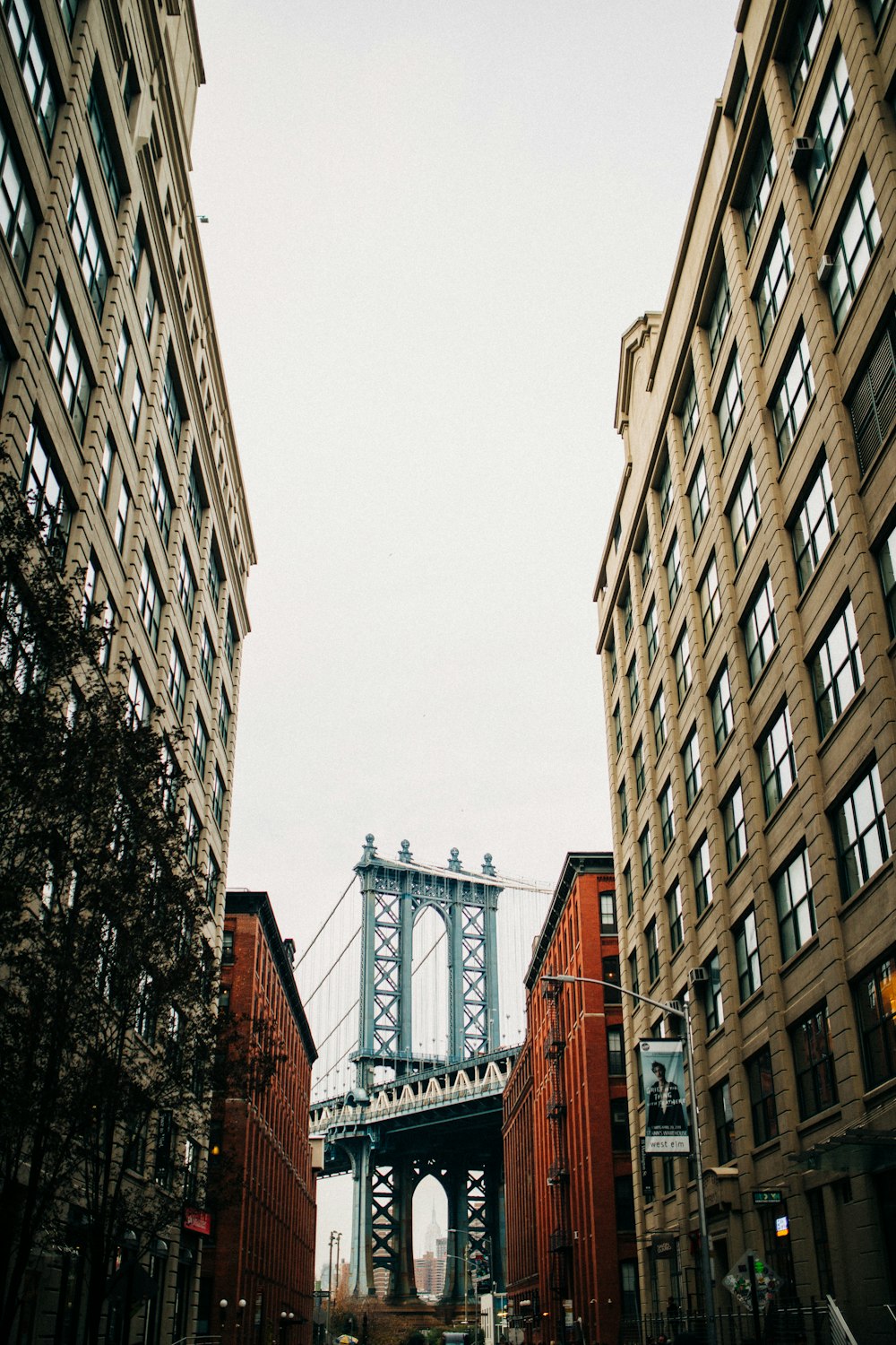 low-angle view of buildings near bridge