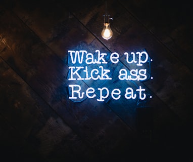 blue wake up kick ass repeat neon sign