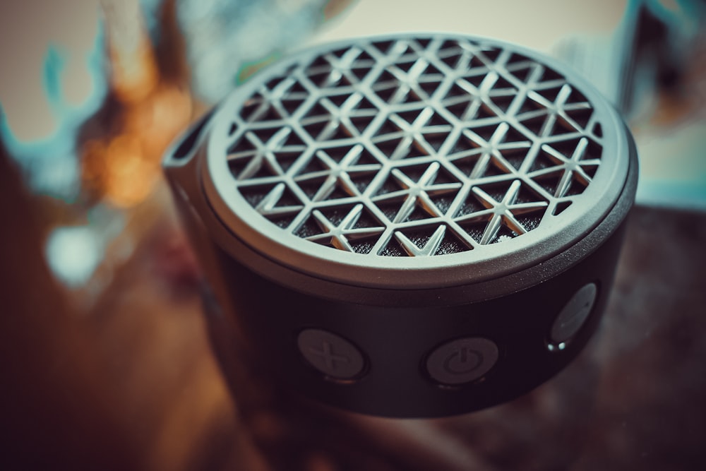 round gray portable speaker