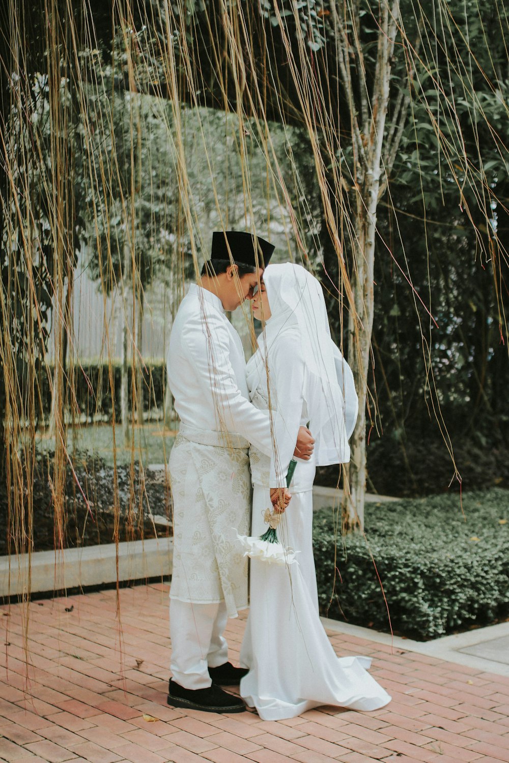 man and woman standing while kissing