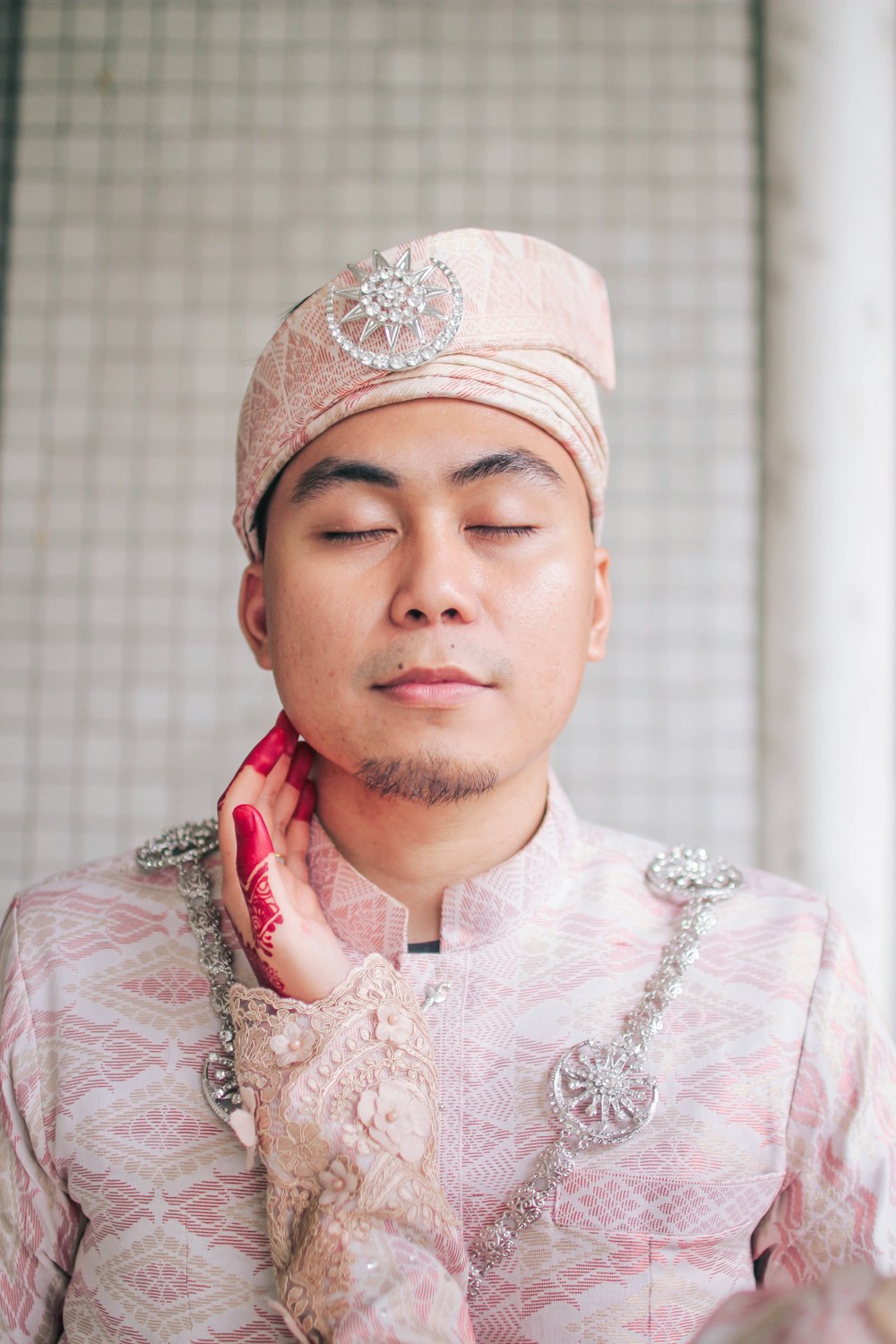 shallow focus photo of man wearing pink headdress