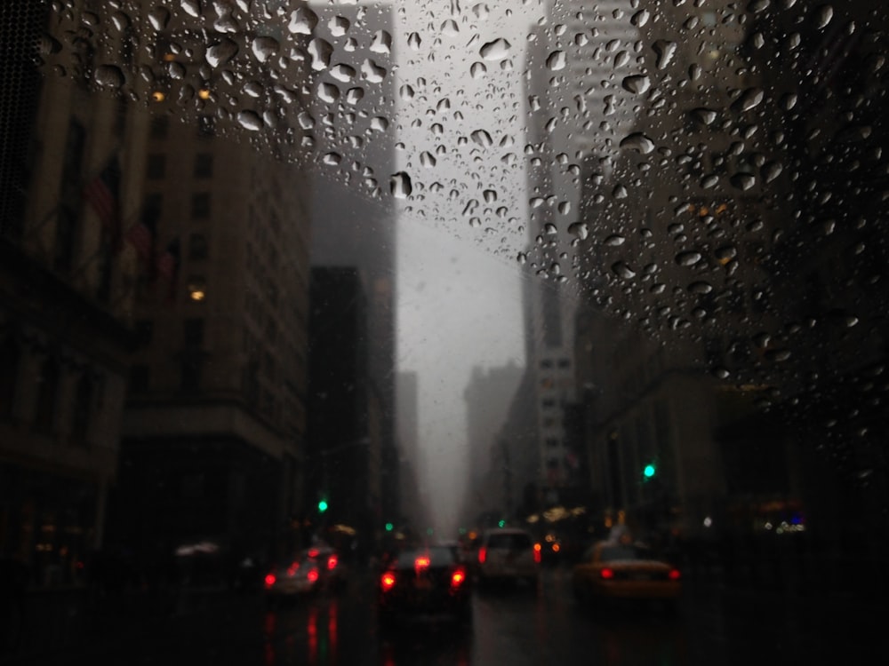 a city street filled with lots of rain