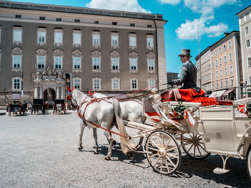 man riding on carriage