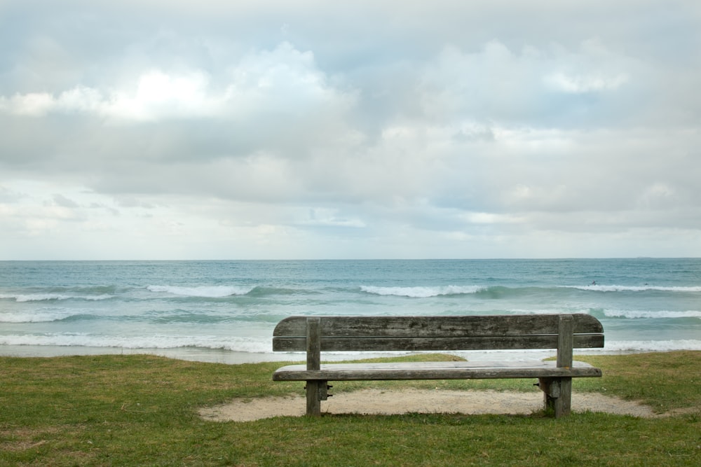 empty bench fronting sea