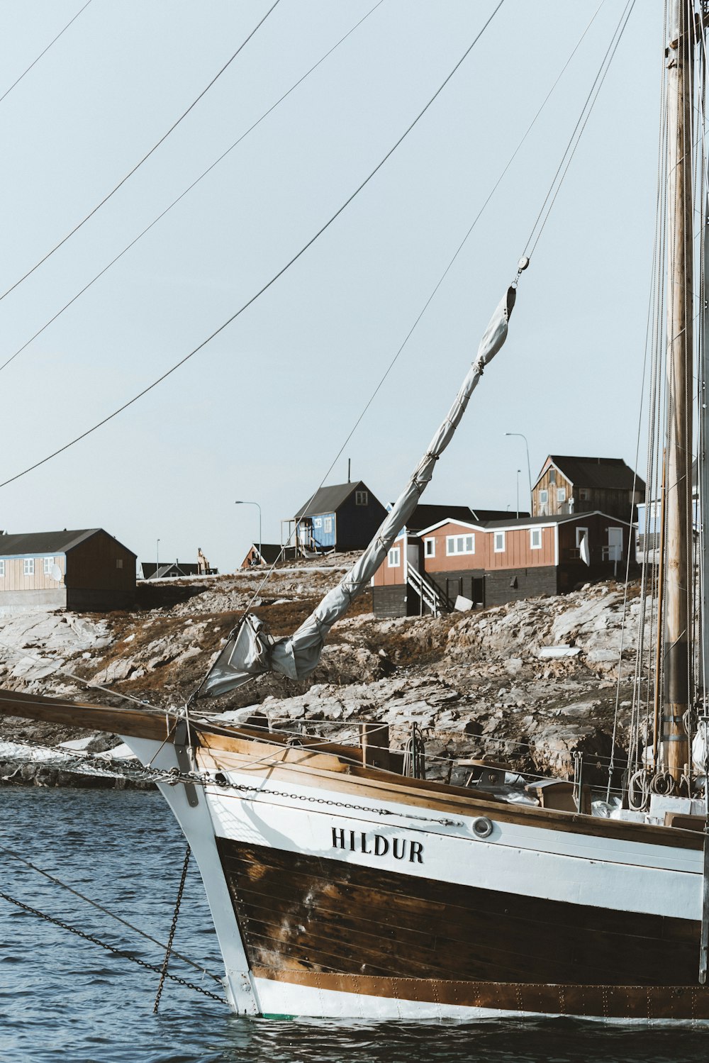 boat docked beside houses