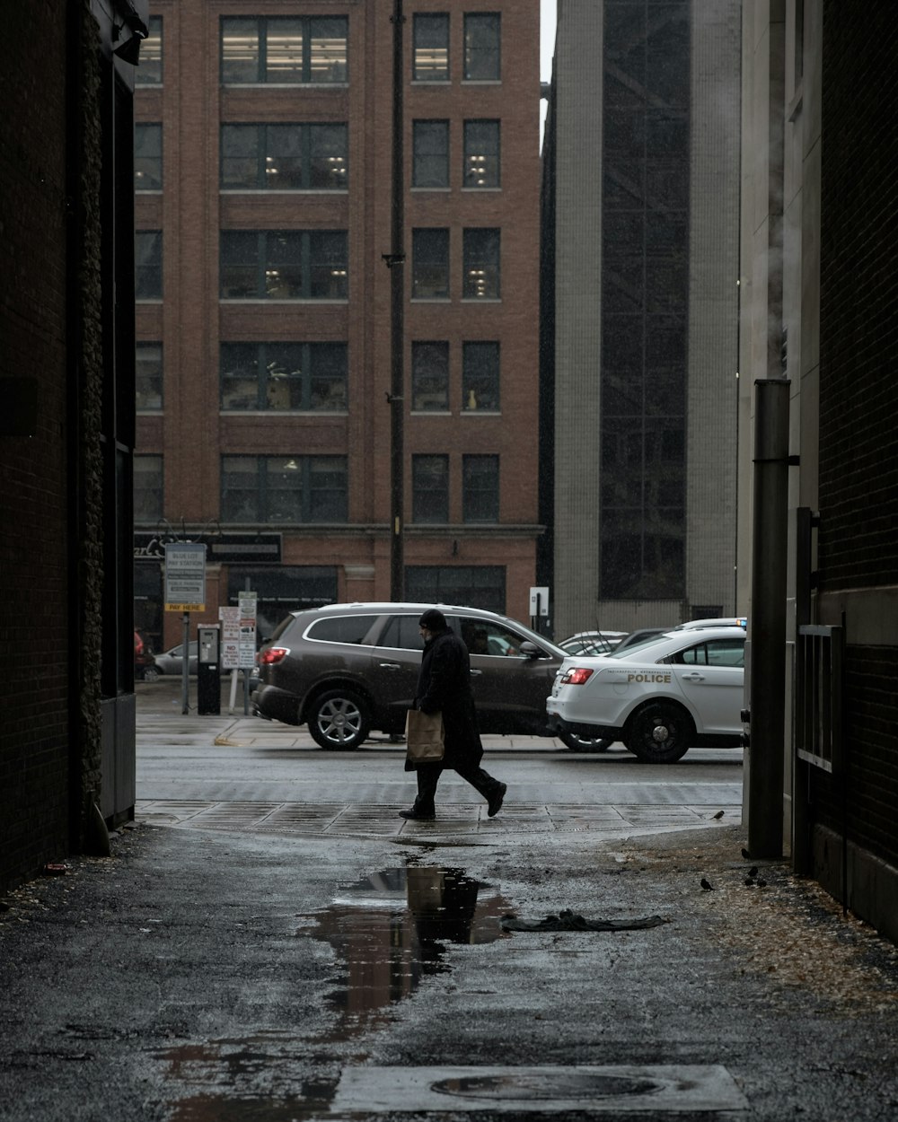 man walking beside road