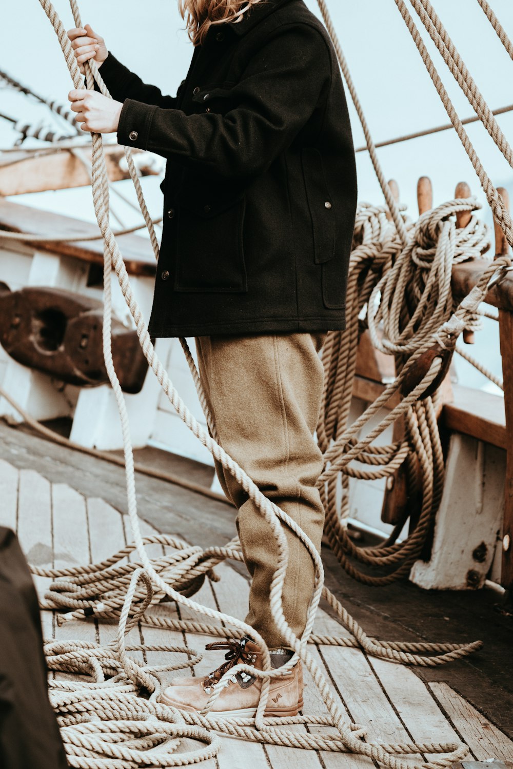 man standing on boat during daytime