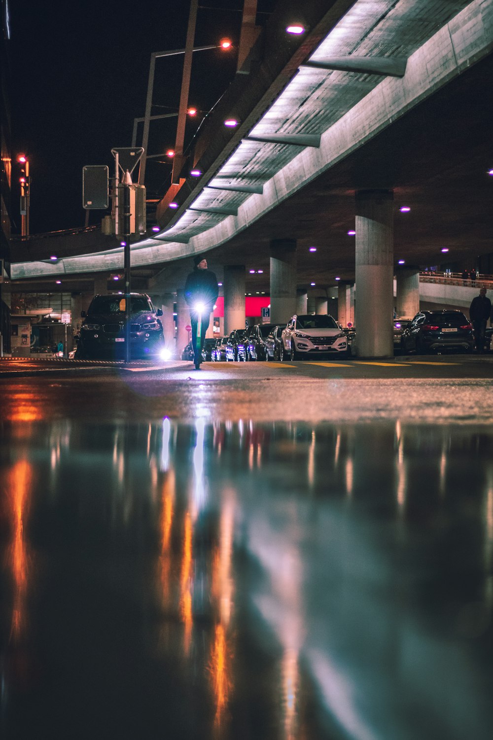 person standing near flyover road