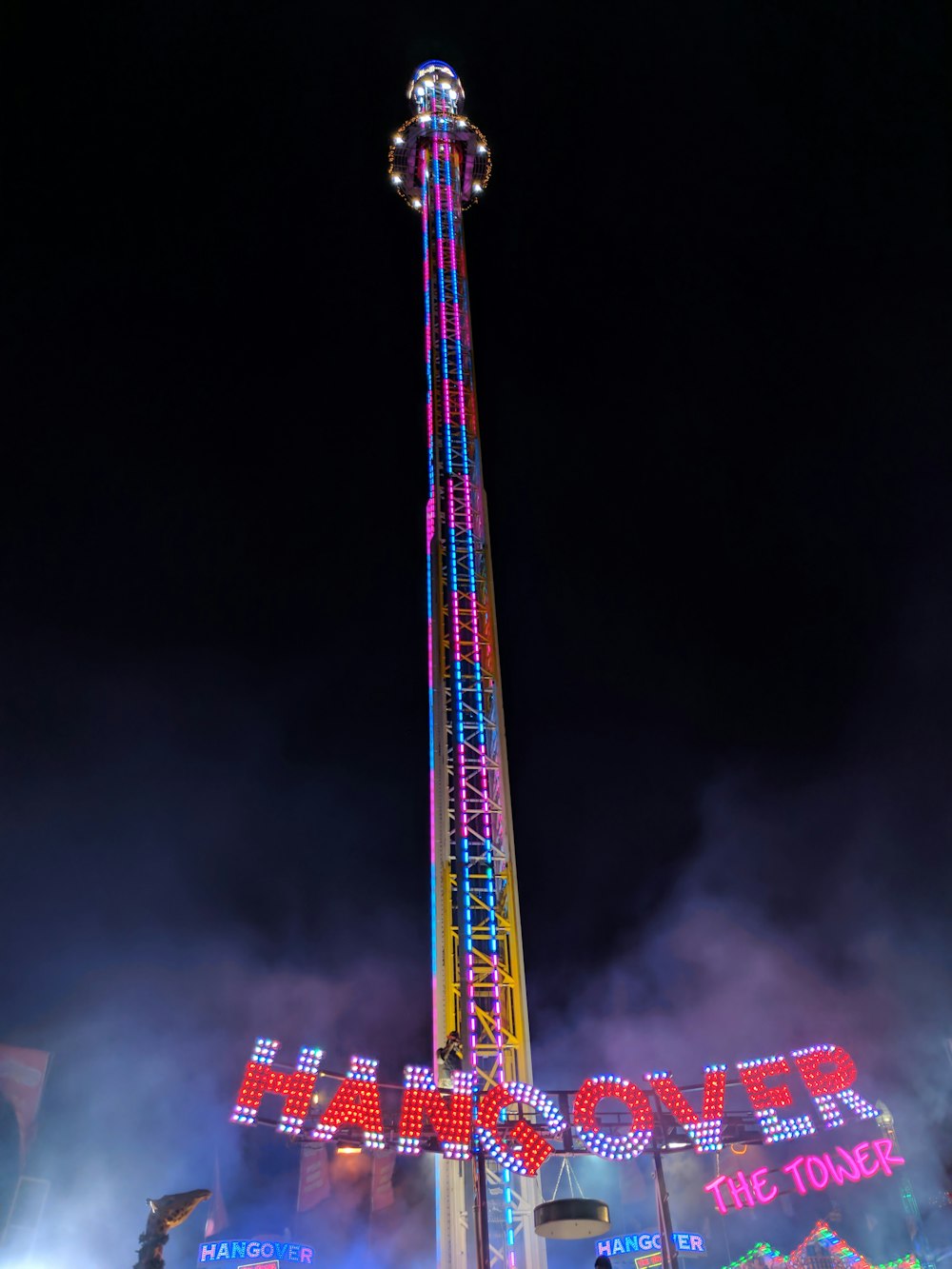 pink and blue Hangover tower at night time