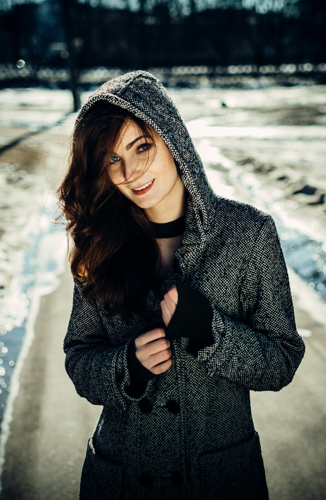 woman wearing gray peacoat with hood