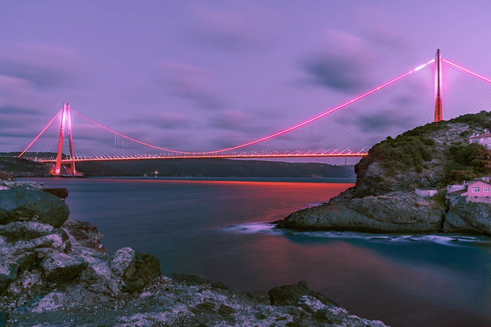 pink bridge and brown mountains