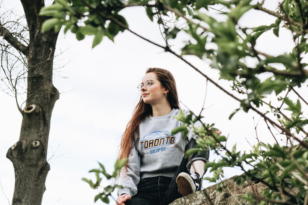 woman near green leaf tree