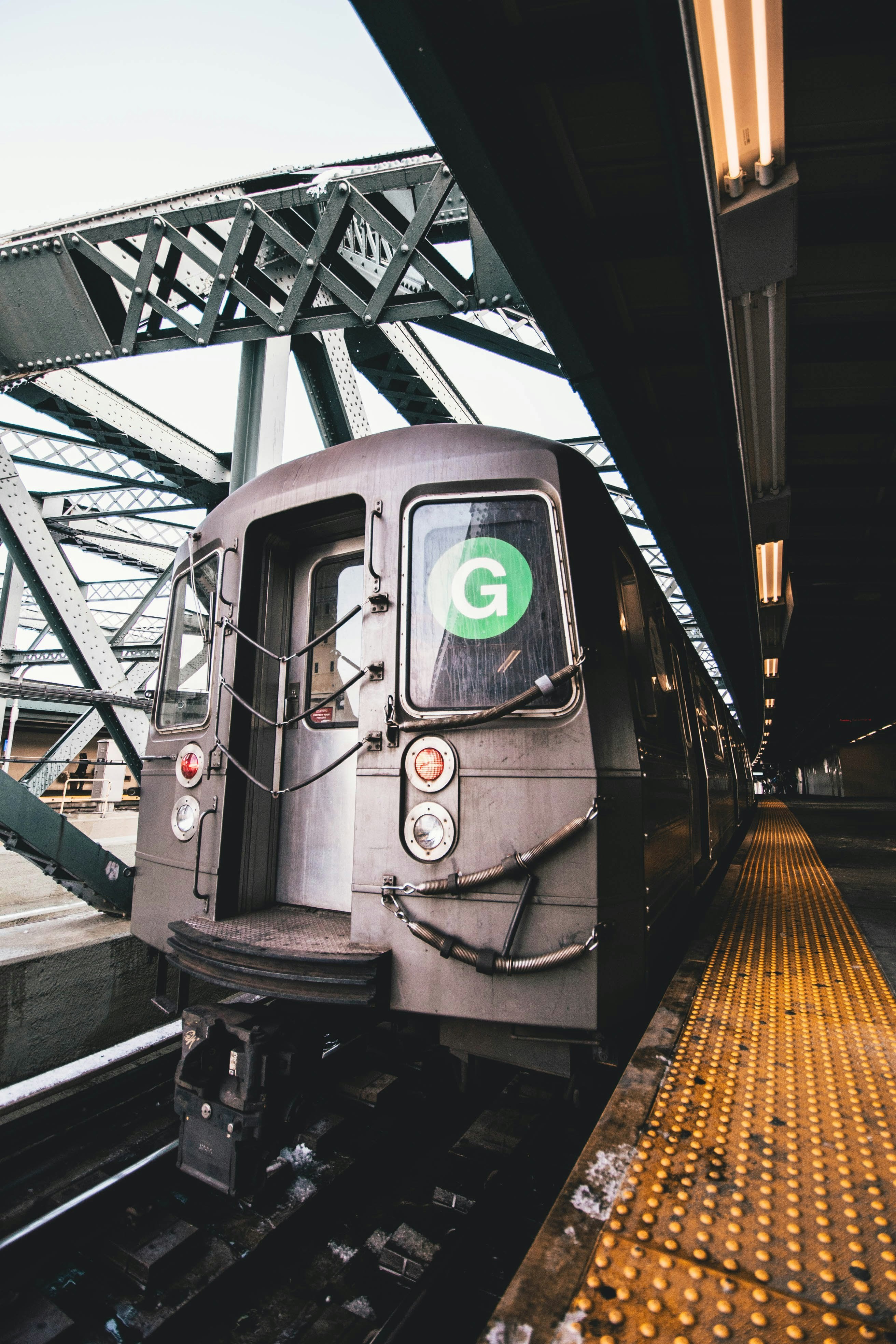 grey train under grey clouds