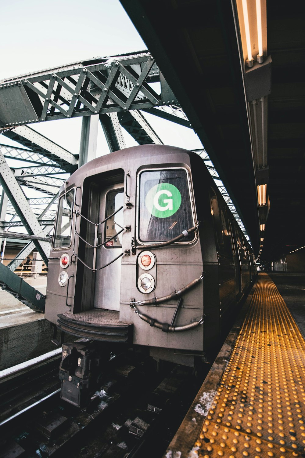 grey train under grey clouds