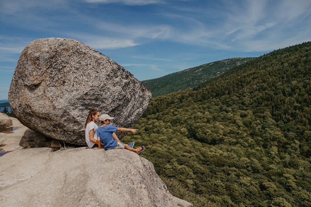 man and boy at the peak