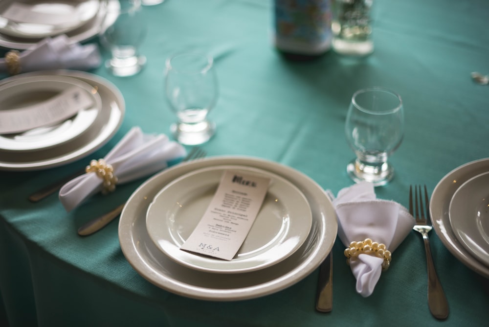 round white ceramic plates on table