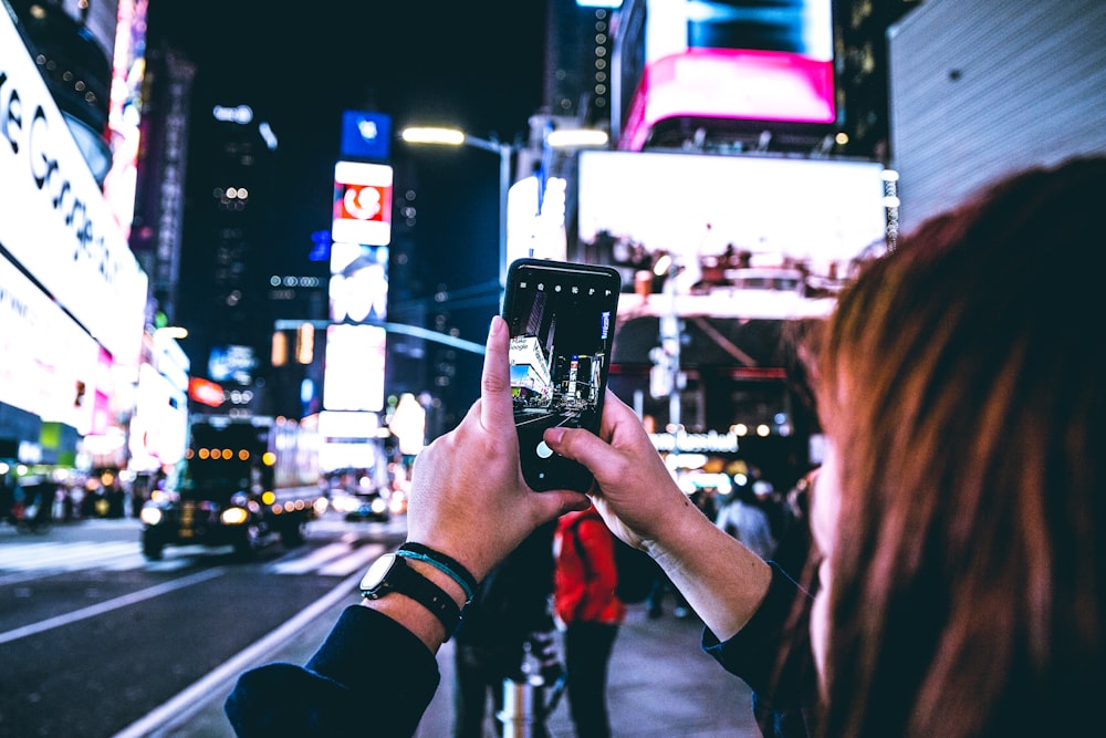 woman taking pictures