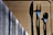 A set of shiny metal forks and knives arranged neatly on a linen napkin.
