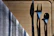 A set of shiny metal forks and knives arranged neatly on a linen napkin.