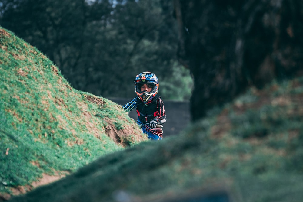 person wearing helmet riding motorcycle during day