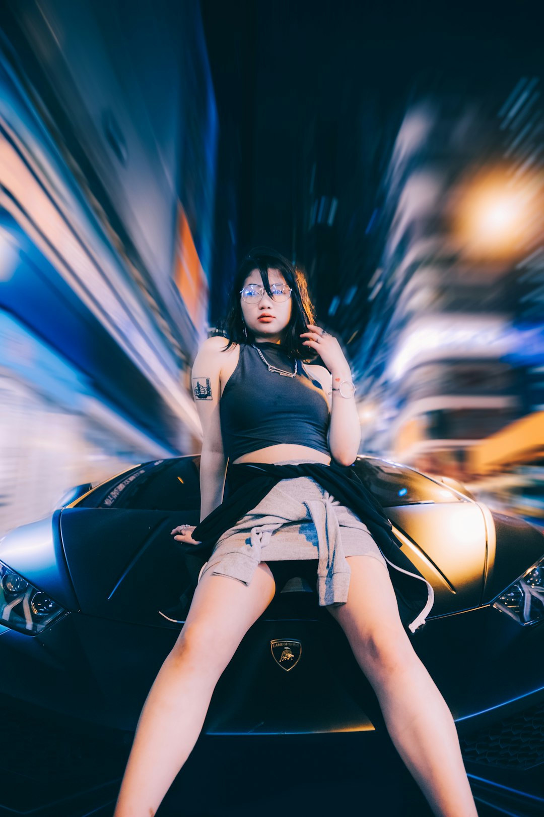 woman sitting on Lamborghini vehicle